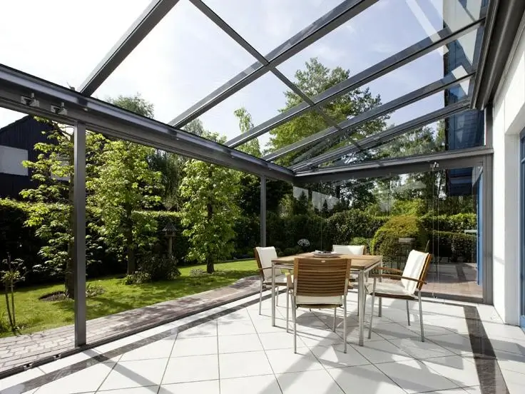 Modern glass roof conservatory with natural sunlight and aluminum framing