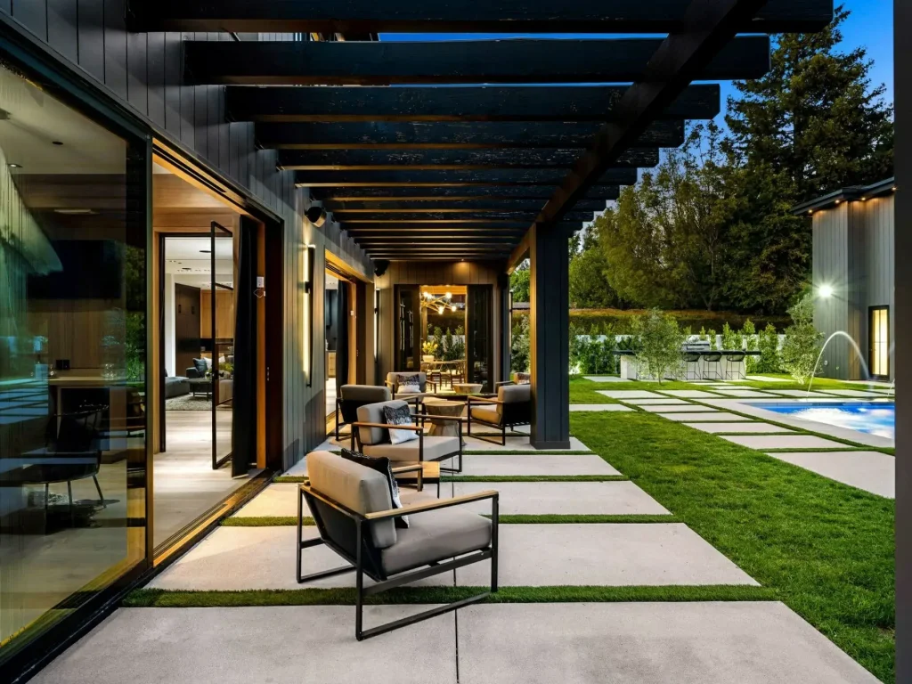 Modern garden seating area with pergola and outdoor furniture