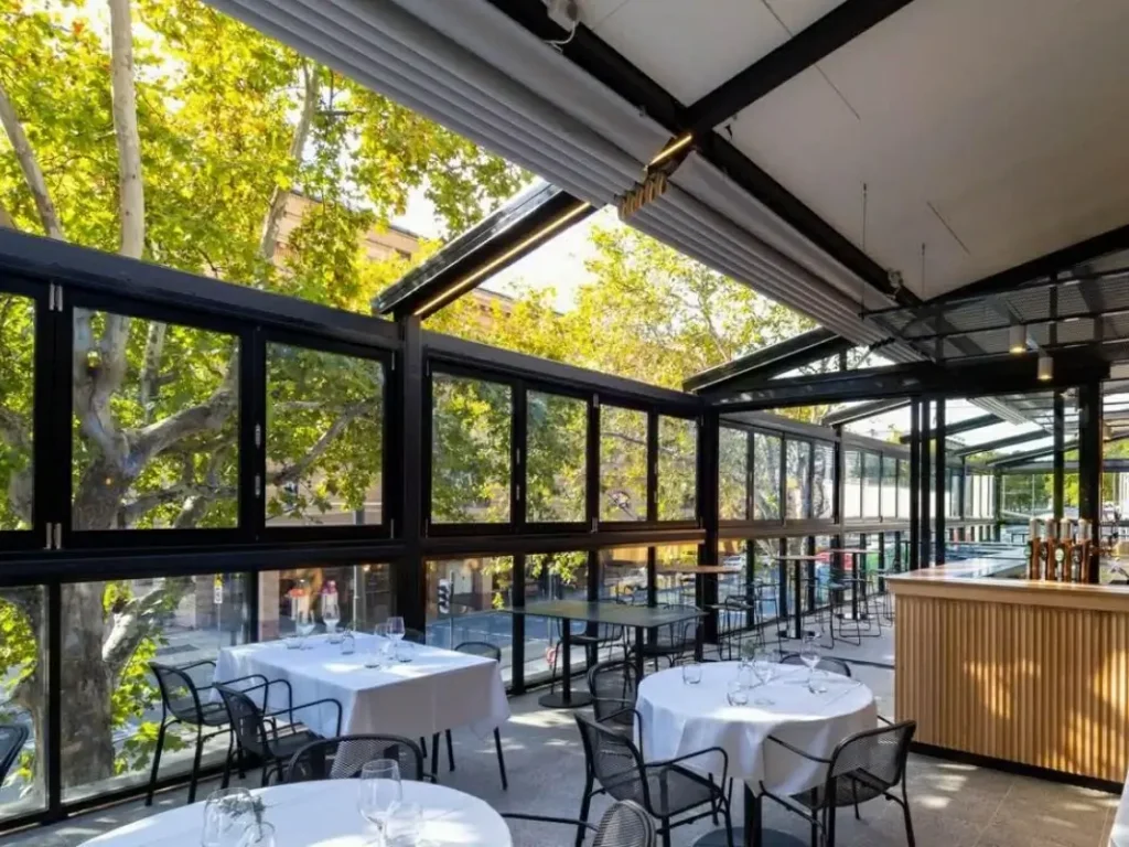 Enclosed outdoor dining area designed for restaurants and cafes